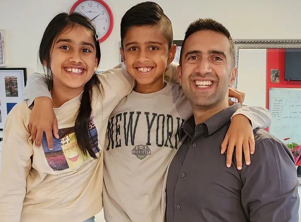 Karishma, Azad and their dad Amit at home in Auckland